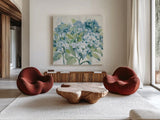 Romantic Hydrangeas Blue by Silvia Vassileva. Shown as extra-large giant wall art in a modern living room. Available as an archival giclee rolled canvas, fine art paper, or poster print. SKU 85227a.