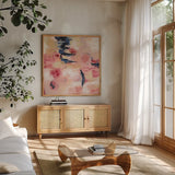 Sakura I by Silvia Vassileva. Shown in a natural wood frame in a cozy modern living room. Available as an archival giclee rolled canvas, fine art paper, or poster print. SKU 37336a.