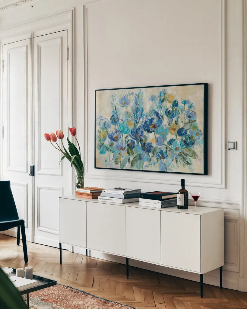 Scattered Blue Flowers by Silvia Vassileva. shown as a framed stretched canvas in a living room above a console. Available as a archival giclee rolled canvas, fine art paper, or poster print. SKU 35309i.