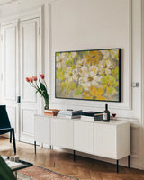 Scattered Spring Petals by Silvia Vassileva. shown as a framed stretched canvas in a living room above a console. Available as a archival giclee rolled canvas, fine art paper, or poster print. SKU 33969i.