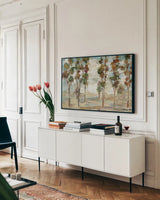 Serene Forest by Silvia Vassileva. shown as a framed stretched canvas in a living room above a console. Available as a archival giclee rolled canvas, fine art paper, or poster print. SKU 26436i.