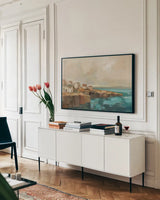 Southern Coast Town by Silvia Vassileva. shown as a framed stretched canvas in a living room above a console. Available as a archival giclee rolled canvas, fine art paper, or poster print. SKU 97923i.