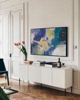 Sparkle Abstract III Blue Crop by Silvia Vassileva. shown as a framed stretched canvas in a living room above a console. Available as a archival giclee rolled canvas, fine art paper, or poster print. SKU 65020i.