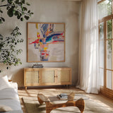 Summer Pinwheel by Silvia Vassileva. Shown in a natural wood frame in a cozy modern living room. Available as an archival giclee rolled canvas, fine art paper, or poster print. SKU 79164a.