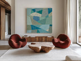 Teal Geo Metric by Silvia Vassileva. Shown as extra-large giant wall art in a modern living room. Available as an archival giclee rolled canvas, fine art paper, or poster print. SKU 23836a.