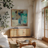 Teal and Aqua Reflections III by Silvia Vassileva. Shown in a natural wood frame in a cozy modern living room. Available as an archival giclee rolled canvas, fine art paper, or poster print. SKU 77945a.