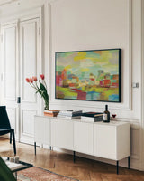Town by the River by Silvia Vassileva. shown as a framed stretched canvas in a living room above a console. Available as a archival giclee rolled canvas, fine art paper, or poster print. SKU 27124i.