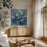 Ultramarine Waves II by Silvia Vassileva. Shown in a natural wood frame in a cozy modern living room. Available as an archival giclee rolled canvas, fine art paper, or poster print. SKU 24575a.