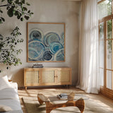 Variation Blue Grey II by Silvia Vassileva. Shown in a natural wood frame in a cozy modern living room. Available as an archival giclee rolled canvas, fine art paper, or poster print. SKU 35714a.