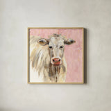 White Cow on Pink by Silvia Vassileva. Shown in a natural wood glass frame for a timeless modern aesthetic. Available as an archival giclee rolled canvas, fine art paper, or poster print. SKU 69171a.