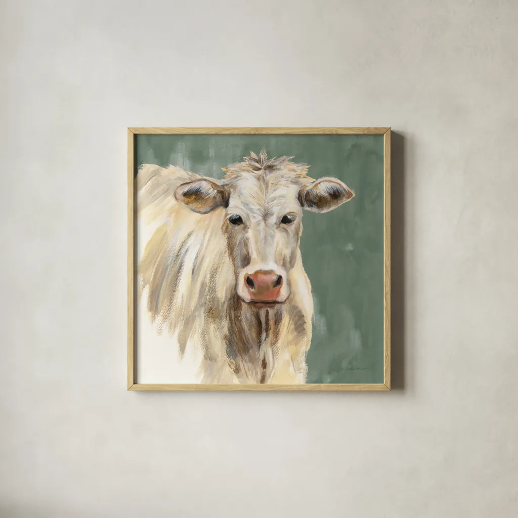 White Cow on Sage by Silvia Vassileva. Shown in a natural wood glass frame for a timeless modern aesthetic. Available as an archival giclee rolled canvas, fine art paper, or poster print. SKU 70336a.