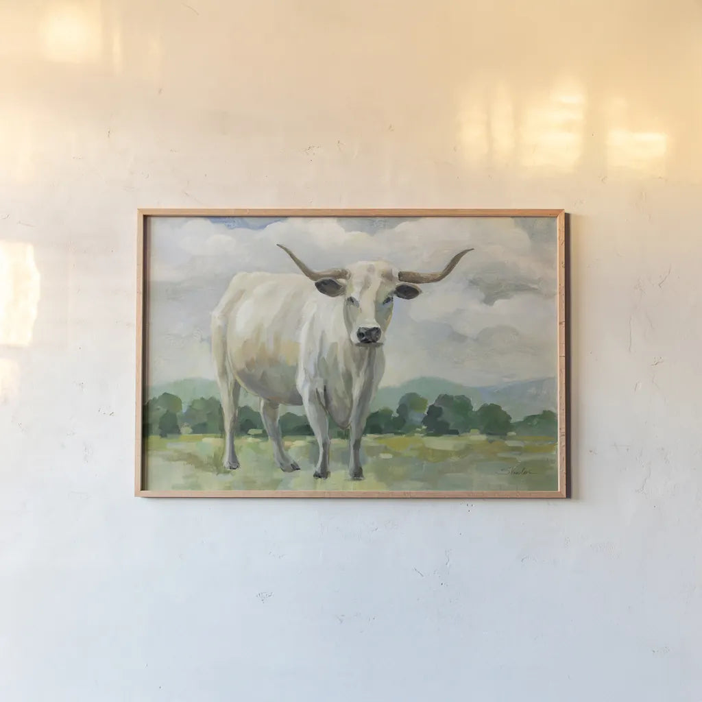 White Longhorn Cow by Silvia Vassileva. shown as a paper print in a natural frame. Available as a archival giclee rolled canvas, fine art paper, or poster print. SKU 84273i.