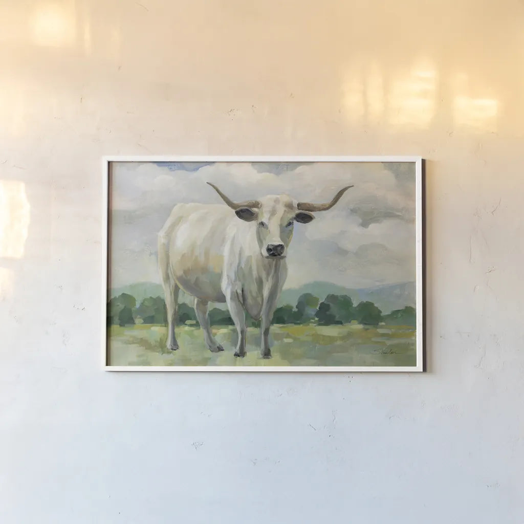 White Longhorn Cow by Silvia Vassileva. shown as a paper print in a white frame. Available as a archival giclee rolled canvas, fine art paper, or poster print. SKU 84273i.