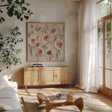 White and Blush Flowers by Silvia Vassileva. Shown in a natural wood frame in a cozy modern living room. Available as an archival giclee rolled canvas, fine art paper, or poster print. SKU 89033a.