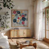 Winter Flowers II by Silvia Vassileva. Shown in a natural wood frame in a cozy modern living room. Available as an archival giclee rolled canvas, fine art paper, or poster print. SKU 23934a.