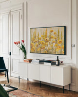 Yellow Field by Silvia Vassileva. shown as a framed stretched canvas in a living room above a console. Available as a archival giclee rolled canvas, fine art paper, or poster print. SKU 98018i.