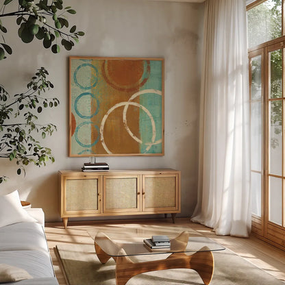 Abstract of Circles 24x24 by Studio Mousseau. Shown in a natural wood frame in a cozy modern living room. Available as an archival giclee rolled canvas, fine art paper, or poster print. SKU 39820a.