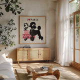 Paris Pooch by Studio Mousseau. Shown in a natural wood frame in a cozy modern living room. Available as an archival giclee rolled canvas, fine art paper, or poster print. SKU 11945a.