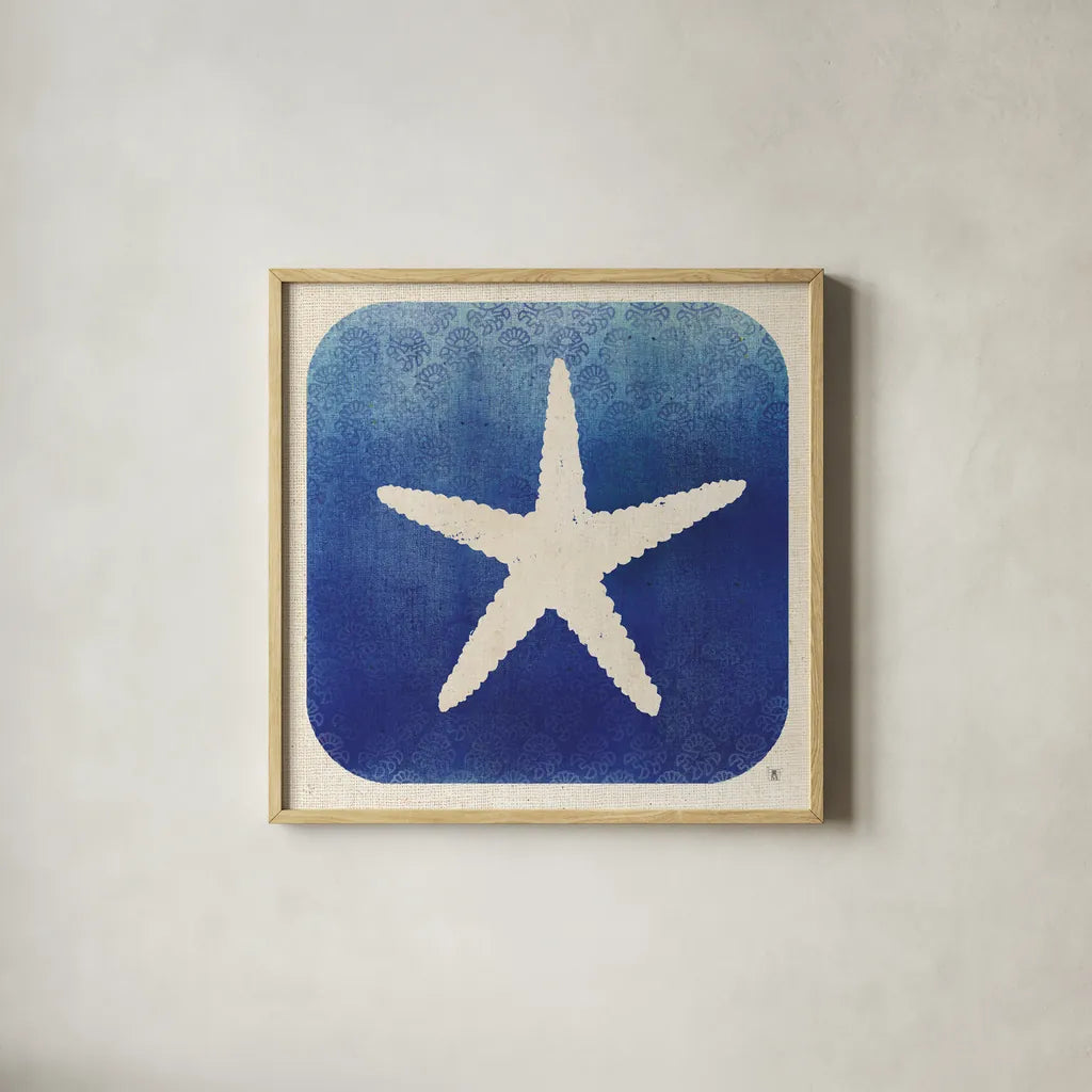 Watermark Starfish by Studio Mousseau. Shown in a natural wood glass frame for a timeless modern aesthetic. Available as an archival giclee rolled canvas, fine art paper, or poster print. SKU 25972a.