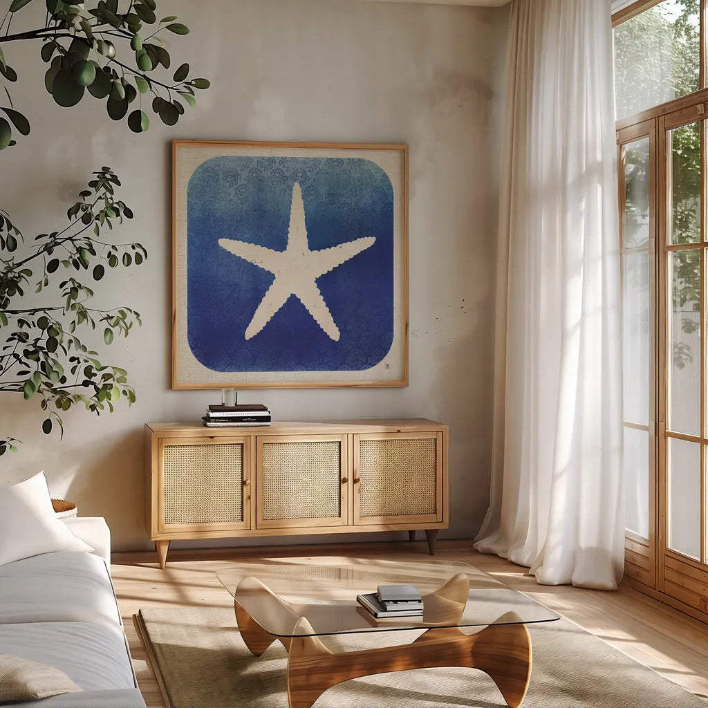Watermark Starfish by Studio Mousseau. Shown in a natural wood frame in a cozy modern living room. Available as an archival giclee rolled canvas, fine art paper, or poster print. SKU 25972a.