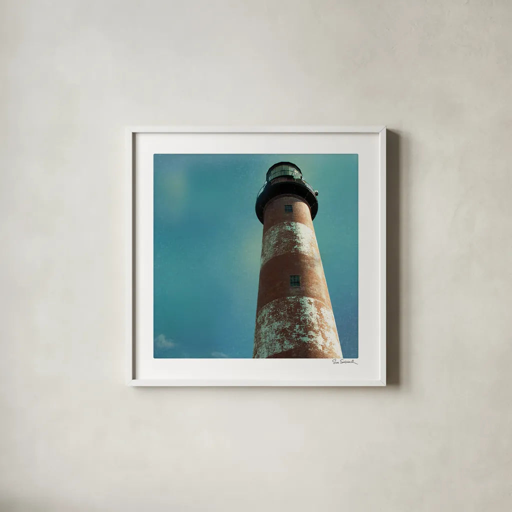Atlantic Lighthouse by Sue Schlabach. Shown in a crisp white glass frame for a clean and minimalist style. Available as an archival giclee rolled canvas, fine art paper, or poster print. SKU 25828a.