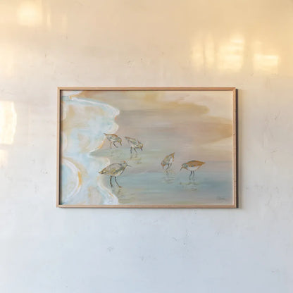 Back Bay Sandpipers by Sue Schlabach. shown as a paper print in a natural frame. Available as a archival giclee rolled canvas, fine art paper, or poster print. SKU 85241i.