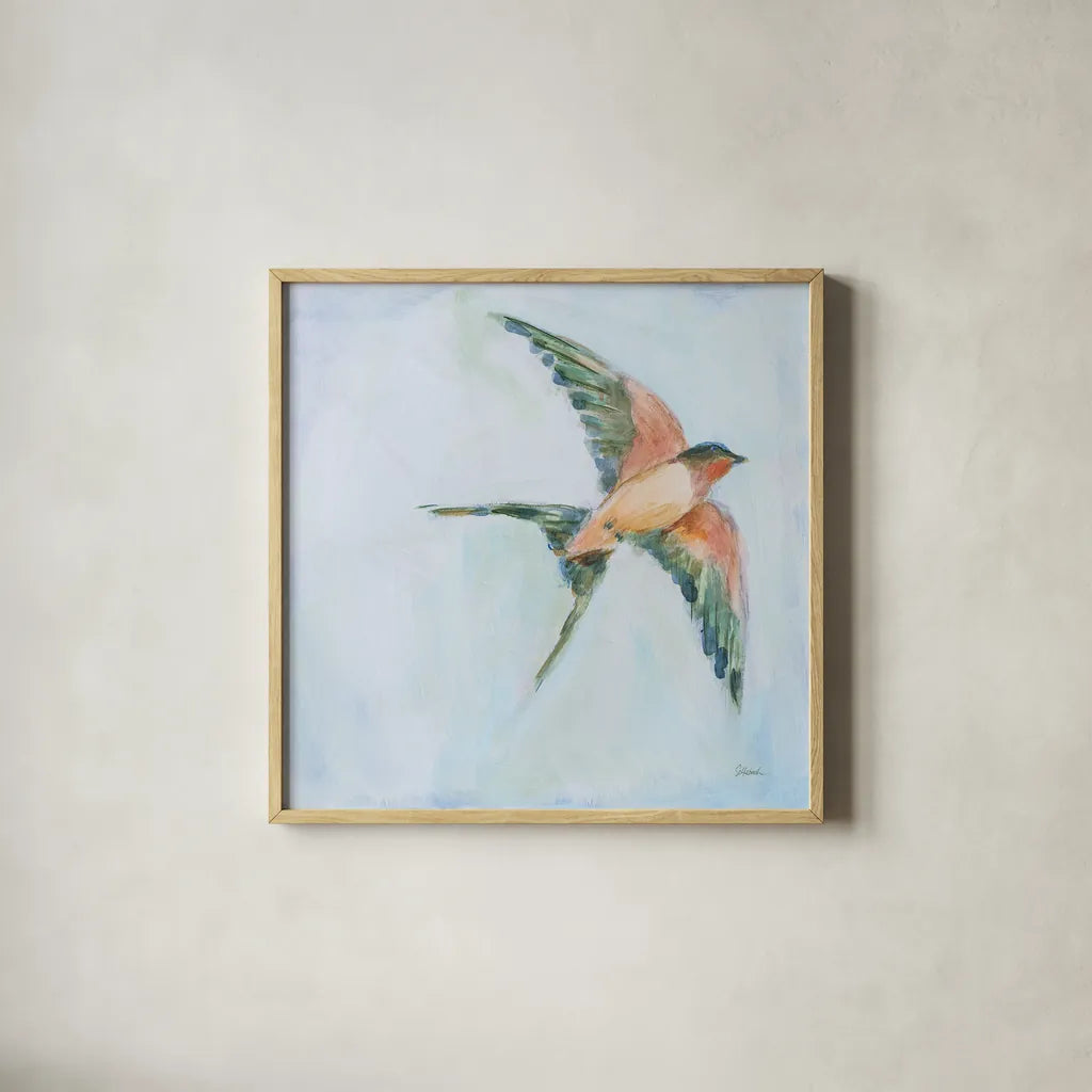 Barn Swallow Flight II by Sue Schlabach. Shown in a natural wood glass frame for a timeless modern aesthetic. Available as an archival giclee rolled canvas, fine art paper, or poster print. SKU 84228a.