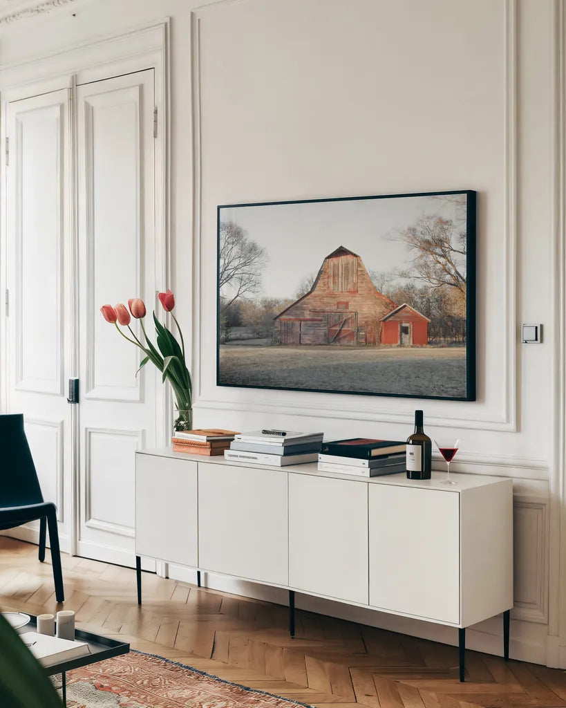 Barn in the Heartland by Sue Schlabach. shown as a framed stretched canvas in a living room above a console. Available as a archival giclee rolled canvas, fine art paper, or poster print. SKU 82861i.