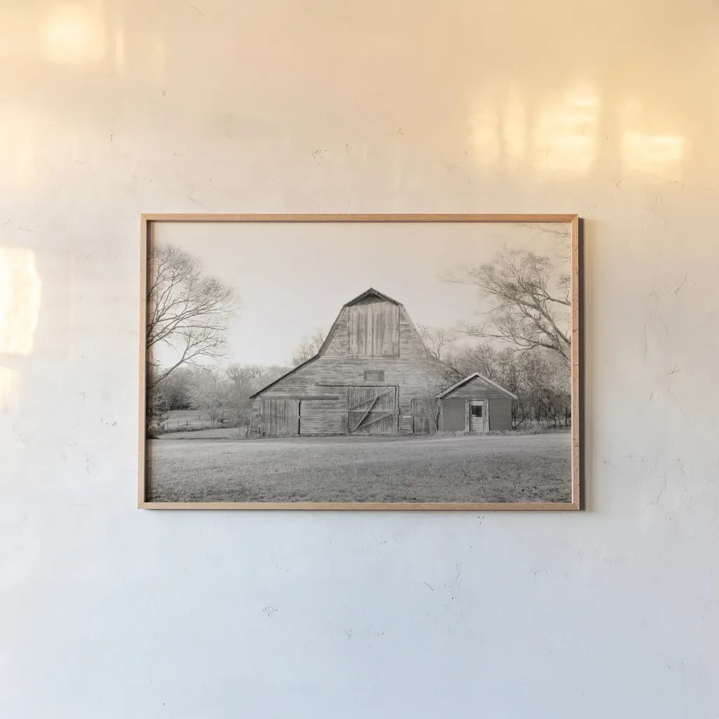 Barn in the Heartland BW by Sue Schlabach. shown as a paper print in a natural frame. Available as a archival giclee rolled canvas, fine art paper, or poster print. SKU 82862i.