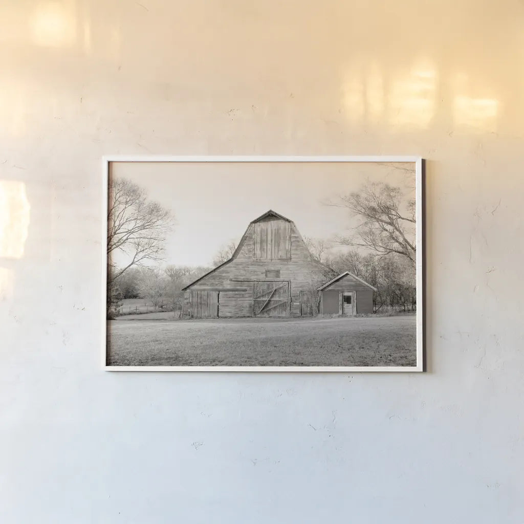 Barn in the Heartland BW by Sue Schlabach. shown as a paper print in a white frame. Available as a archival giclee rolled canvas, fine art paper, or poster print. SKU 82862i.