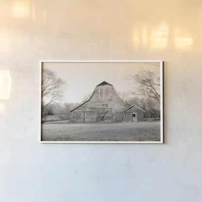 Barn in the Heartland BW by Sue Schlabach. shown as a paper print in a white frame. Available as a archival giclee rolled canvas, fine art paper, or poster print. SKU 82862i.