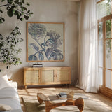 Belle Fleur I by Sue Schlabach. Shown in a natural wood frame in a cozy modern living room. Available as an archival giclee rolled canvas, fine art paper, or poster print. SKU 20083a.
