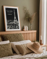 Black Blueprint Map Eiffel Tower by Sue Schlabach. shown as a paper print in a natural frame. Available as a archival giclee rolled canvas, fine art paper, or poster print. SKU 36395h.