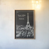 Black Blueprint Map Eiffel Tower by Sue Schlabach. shown as a paper print in a natural frame. Available as a archival giclee rolled canvas, fine art paper, or poster print. SKU 36395h.