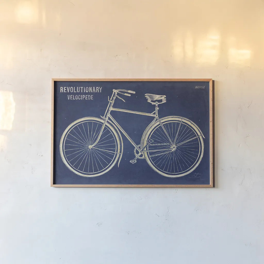 Blueprint Bicycle by Sue Schlabach. shown as a paper print in a natural frame. Available as a archival giclee rolled canvas, fine art paper, or poster print. SKU 47418i.