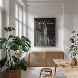Blueprint Map New York Chrysler Building Black by Sue Schlabach. shown as a print in a natural wood frame in a dining room. Available as a archival giclee rolled canvas, fine art paper, or poster print. SKU 22805h.