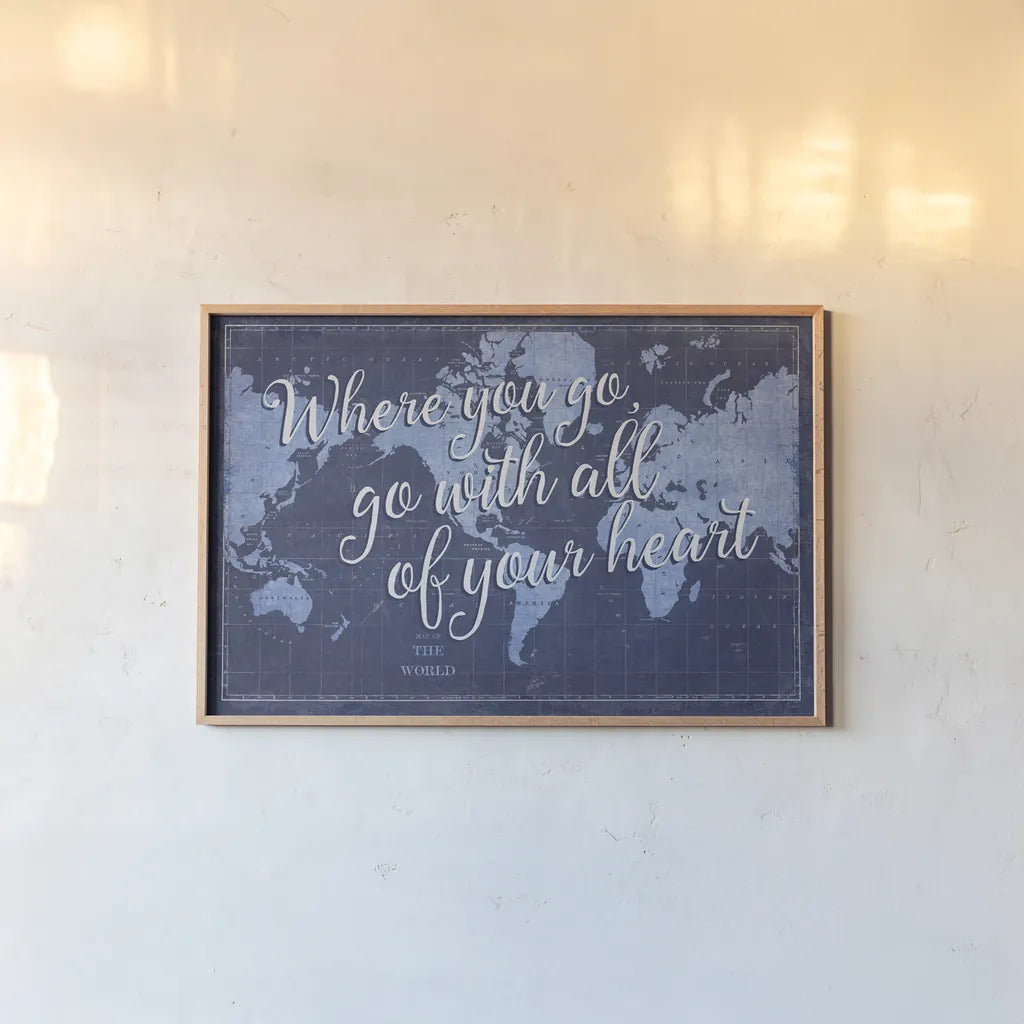 Blueprint World Map Heart by Sue Schlabach. shown as a paper print in a natural frame. Available as a archival giclee rolled canvas, fine art paper, or poster print. SKU 51897i.