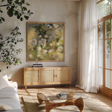 Blush Blossoms I Square by Sue Schlabach. Shown in a natural wood frame in a cozy modern living room. Available as an archival giclee rolled canvas, fine art paper, or poster print. SKU 22115a.