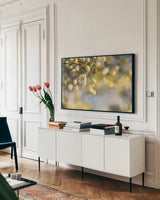 Blush Blossoms II by Sue Schlabach. shown as a framed stretched canvas in a living room above a console. Available as a archival giclee rolled canvas, fine art paper, or poster print. SKU 22116i.
