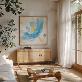 Breeze Bloom V v2 by Sue Schlabach. Shown in a natural wood frame in a cozy modern living room. Available as an archival giclee rolled canvas, fine art paper, or poster print. SKU 20862a.