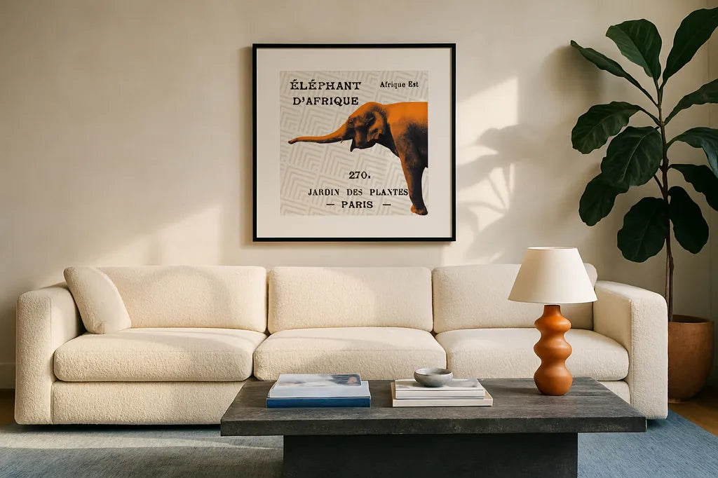 Bright Safari Elephant on Taupe by Sue Schlabach. Displayed in a glass frame with matte in a clean modern living room. Available as an archival giclee rolled canvas, fine art paper, or poster print. SKU 44788a.
