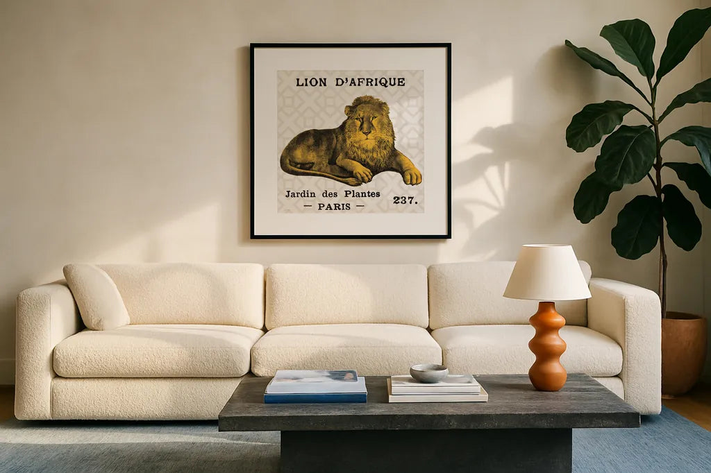 Bright Safari Lion on Taupe by Sue Schlabach. Displayed in a glass frame with matte in a clean modern living room. Available as an archival giclee rolled canvas, fine art paper, or poster print. SKU 44790a.