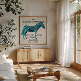 Bright Safari Zebra on Taupe by Sue Schlabach. Shown in a natural wood frame in a cozy modern living room. Available as an archival giclee rolled canvas, fine art paper, or poster print. SKU 44791a.