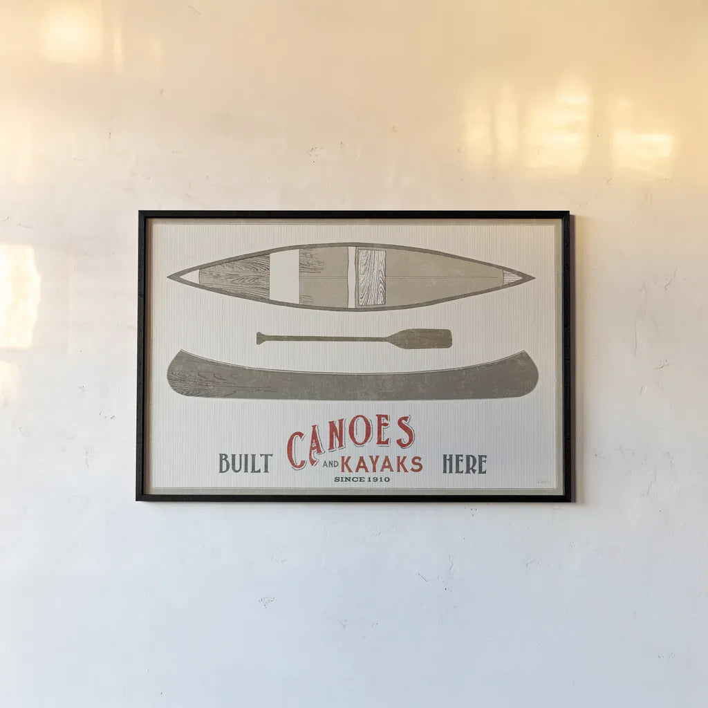 Cabin Life VII Kayak by Sue Schlabach. shown as a paper print in a black flame. Available as a archival giclee rolled canvas, fine art paper, or poster print. SKU 53655i.