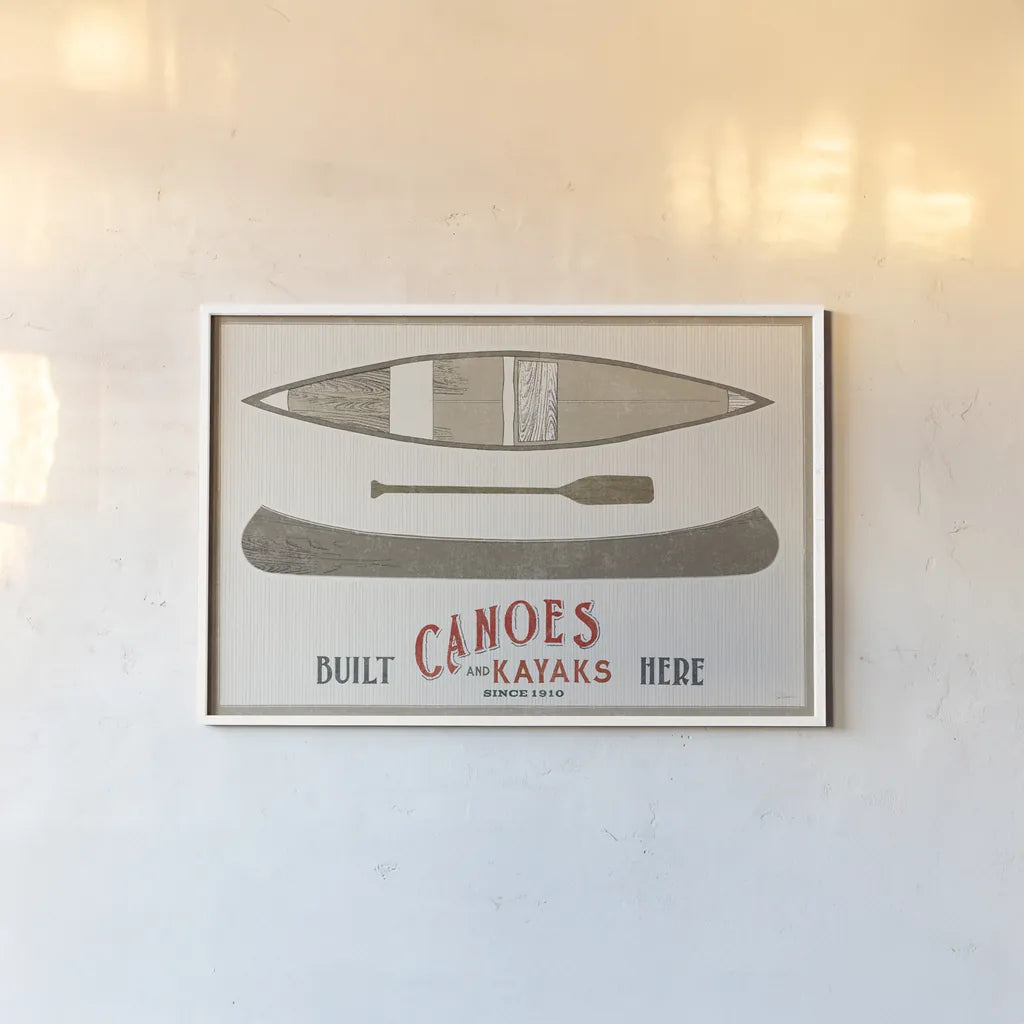 Cabin Life VII Kayak by Sue Schlabach. shown as a paper print in a white frame. Available as a archival giclee rolled canvas, fine art paper, or poster print. SKU 53655i.