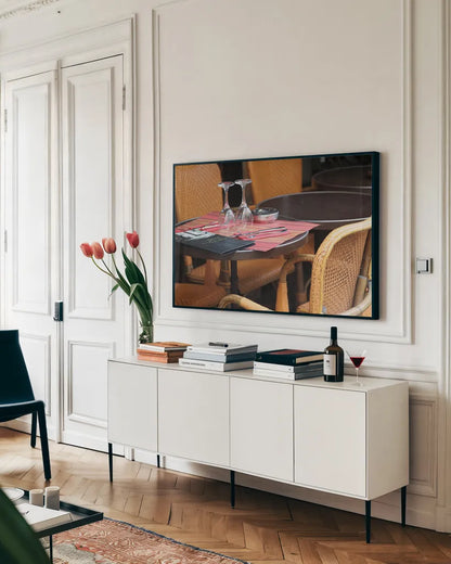 Cafe in Paris II by Sue Schlabach. shown as a framed stretched canvas in a living room above a console. Available as a archival giclee rolled canvas, fine art paper, or poster print. SKU 34159i.