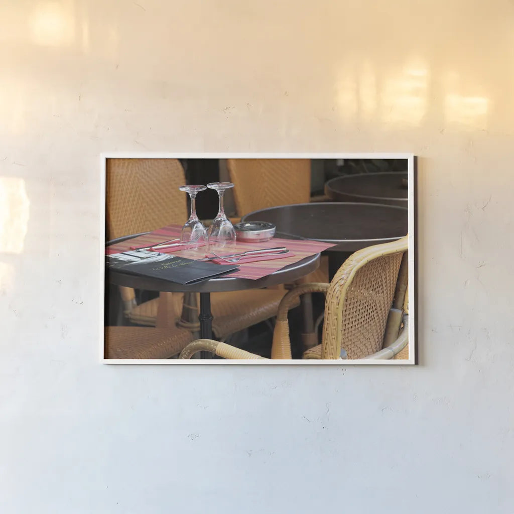 Cafe in Paris II by Sue Schlabach. shown as a paper print in a white frame. Available as a archival giclee rolled canvas, fine art paper, or poster print. SKU 34159i.