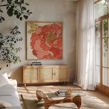 Camilles Peony Red by Sue Schlabach. Shown in a natural wood frame in a cozy modern living room. Available as an archival giclee rolled canvas, fine art paper, or poster print. SKU 44596a.