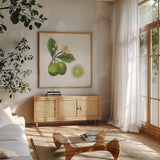Classic Citrus III by Sue Schlabach. Shown in a natural wood frame in a cozy modern living room. Available as an archival giclee rolled canvas, fine art paper, or poster print. SKU 32041a.