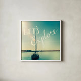 Coastline Sailboat Explore by Sue Schlabach. Shown in a crisp white glass frame for a clean and minimalist style. Available as an archival giclee rolled canvas, fine art paper, or poster print. SKU 15251a.